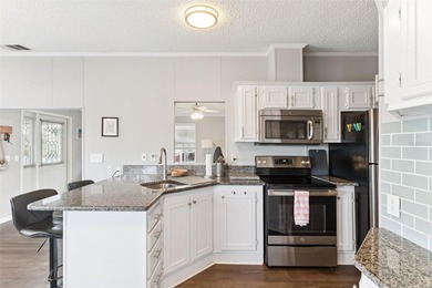 A beautifully updated 2-bedroom, 1-bathroom manufactured home in on Polo Park East in Florida - for sale on GolfHomes.com, golf home, golf lot