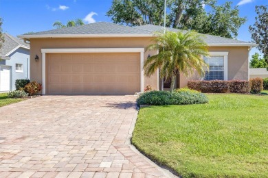 Discover luxurious living in the exclusive gated community of on Imperial Lakes Country Club in Florida - for sale on GolfHomes.com, golf home, golf lot