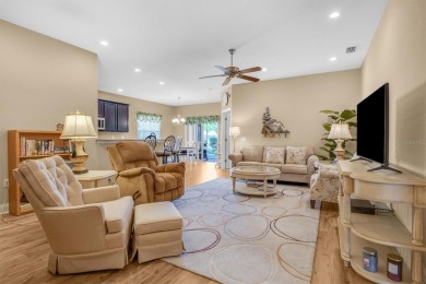 Discover luxurious living in the exclusive gated community of on Imperial Lakes Country Club in Florida - for sale on GolfHomes.com, golf home, golf lot