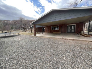 Nestled under the Colorado National Monument, with on Tiara Rado Golf Course in Colorado - for sale on GolfHomes.com, golf home, golf lot