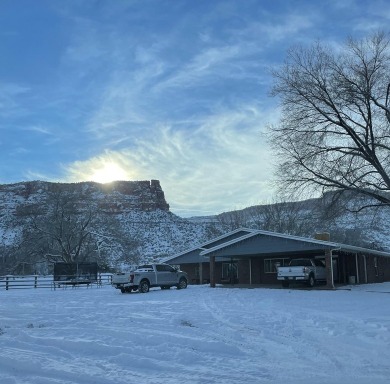 Nestled under the Colorado National Monument, with on Tiara Rado Golf Course in Colorado - for sale on GolfHomes.com, golf home, golf lot