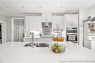 Experience luxury, comfort, and exceptional functionality in on Anderson Creek Golf Club in North Carolina - for sale on GolfHomes.com, golf home, golf lot