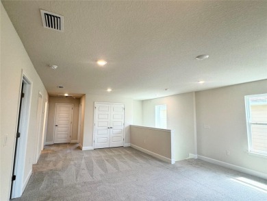 This Stunning Home features 4 bedrooms, 2.5 baths, and a bright on Harmony Golf Preserve in Florida - for sale on GolfHomes.com, golf home, golf lot