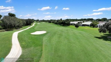 Welcome to your dream home in beautiful Boca Woods Country Club! on Boca Woods Country Club in Florida - for sale on GolfHomes.com, golf home, golf lot