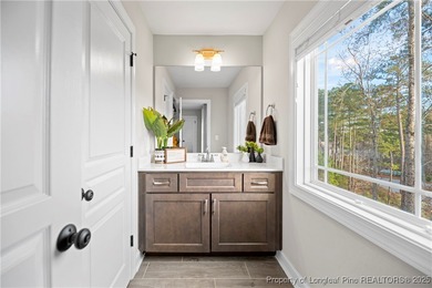 Experience luxury, comfort, and exceptional functionality in on Anderson Creek Golf Club in North Carolina - for sale on GolfHomes.com, golf home, golf lot