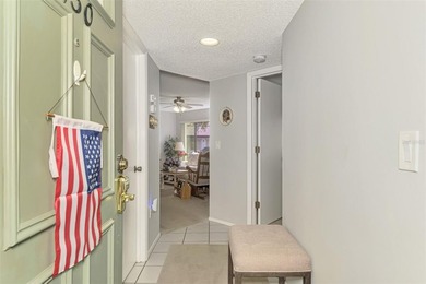 Appealing two bedroom, two bath, first floor, end unit, in the on Capri Isle Golf Club in Florida - for sale on GolfHomes.com, golf home, golf lot