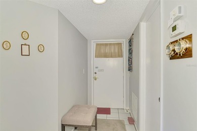 Appealing two bedroom, two bath, first floor, end unit, in the on Capri Isle Golf Club in Florida - for sale on GolfHomes.com, golf home, golf lot