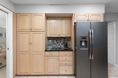 This home is located on the 5th hole of Pine Lakes Golf Course on The Grand Club - Pine Lakes Course in Florida - for sale on GolfHomes.com, golf home, golf lot