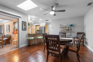 This home is located on the 5th hole of Pine Lakes Golf Course on The Grand Club - Pine Lakes Course in Florida - for sale on GolfHomes.com, golf home, golf lot