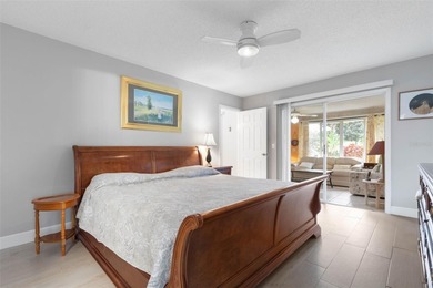 This home is located on the 5th hole of Pine Lakes Golf Course on The Grand Club - Pine Lakes Course in Florida - for sale on GolfHomes.com, golf home, golf lot