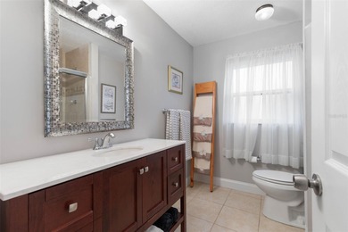 This home is located on the 5th hole of Pine Lakes Golf Course on The Grand Club - Pine Lakes Course in Florida - for sale on GolfHomes.com, golf home, golf lot