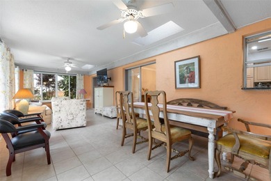 This home is located on the 5th hole of Pine Lakes Golf Course on The Grand Club - Pine Lakes Course in Florida - for sale on GolfHomes.com, golf home, golf lot