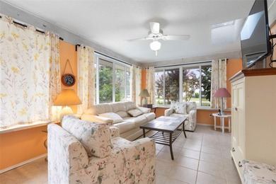 This home is located on the 5th hole of Pine Lakes Golf Course on The Grand Club - Pine Lakes Course in Florida - for sale on GolfHomes.com, golf home, golf lot