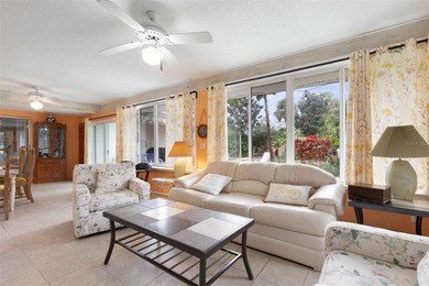 This home is located on the 5th hole of Pine Lakes Golf Course on The Grand Club - Pine Lakes Course in Florida - for sale on GolfHomes.com, golf home, golf lot