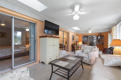 This home is located on the 5th hole of Pine Lakes Golf Course on The Grand Club - Pine Lakes Course in Florida - for sale on GolfHomes.com, golf home, golf lot