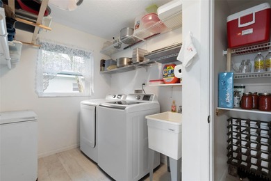 This home is located on the 5th hole of Pine Lakes Golf Course on The Grand Club - Pine Lakes Course in Florida - for sale on GolfHomes.com, golf home, golf lot