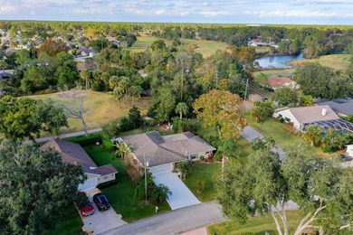 This home is located on the 5th hole of Pine Lakes Golf Course on The Grand Club - Pine Lakes Course in Florida - for sale on GolfHomes.com, golf home, golf lot