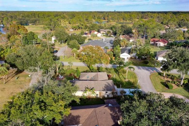 This home is located on the 5th hole of Pine Lakes Golf Course on The Grand Club - Pine Lakes Course in Florida - for sale on GolfHomes.com, golf home, golf lot