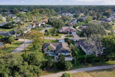 This home is located on the 5th hole of Pine Lakes Golf Course on The Grand Club - Pine Lakes Course in Florida - for sale on GolfHomes.com, golf home, golf lot