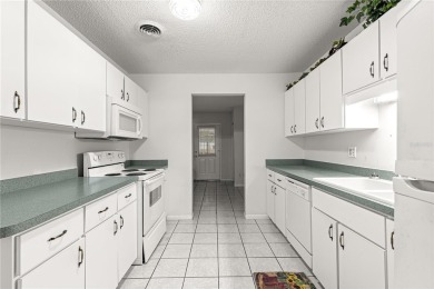 SPACIOUS Two-Level Townhome located in the Americana on On Top of the World Golf Course in Florida - for sale on GolfHomes.com, golf home, golf lot