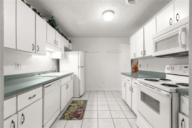 SPACIOUS Two-Level Townhome located in the Americana on On Top of the World Golf Course in Florida - for sale on GolfHomes.com, golf home, golf lot