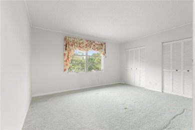 SPACIOUS Two-Level Townhome located in the Americana on On Top of the World Golf Course in Florida - for sale on GolfHomes.com, golf home, golf lot