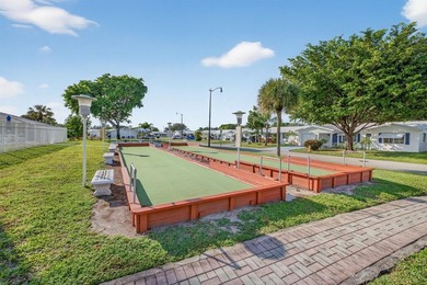 Beautifully renovated 2BR/2BA single-family home with NEW solar on Leisureville Community Association in Florida - for sale on GolfHomes.com, golf home, golf lot