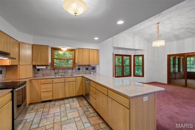 Tucked among the trees this spacious 4-bedroom retreat offers on Innsbrook Resort Golf Course in Missouri - for sale on GolfHomes.com, golf home, golf lot