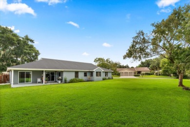 Welcome to this beautifully remodeled 5-bedroom, 3-bath home on Orange Tree Golf Club in Florida - for sale on GolfHomes.com, golf home, golf lot