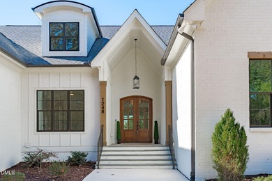 Modern Ranch Farmhouse with Golf Course Views. Built less than on Chapel Ridge Golf Club in North Carolina - for sale on GolfHomes.com, golf home, golf lot