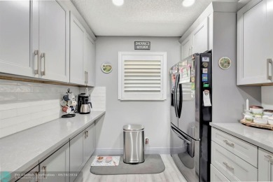 Remodeled 2/2 condo that lives like a home - Impact windows and on Woodmont Country Club in Florida - for sale on GolfHomes.com, golf home, golf lot