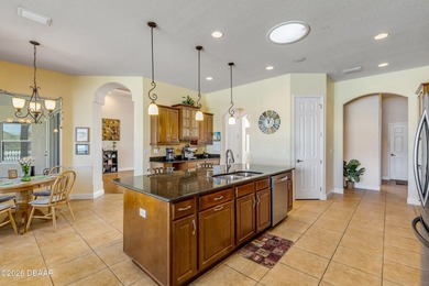 Experience lakeside living in this magnificent lakefront home in on Venetian Bay Golf Course in Florida - for sale on GolfHomes.com, golf home, golf lot