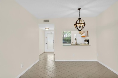 Explore this delightful first-floor unit, boasting two bedrooms on Sunrise Lakes Phase IV Golf Course in Florida - for sale on GolfHomes.com, golf home, golf lot