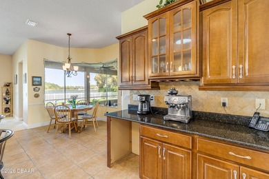 Experience lakeside living in this magnificent lakefront home in on Venetian Bay Golf Course in Florida - for sale on GolfHomes.com, golf home, golf lot