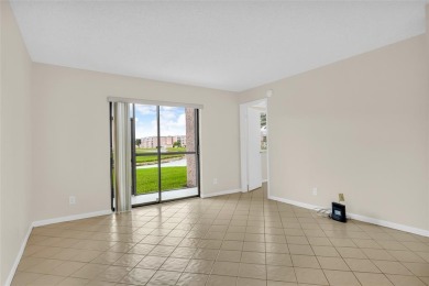 Explore this delightful first-floor unit, boasting two bedrooms on Sunrise Lakes Phase IV Golf Course in Florida - for sale on GolfHomes.com, golf home, golf lot
