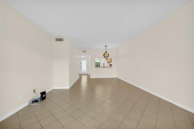 Explore this delightful first-floor unit, boasting two bedrooms on Sunrise Lakes Phase IV Golf Course in Florida - for sale on GolfHomes.com, golf home, golf lot