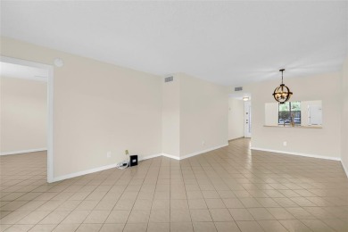 Explore this delightful first-floor unit, boasting two bedrooms on Sunrise Lakes Phase IV Golf Course in Florida - for sale on GolfHomes.com, golf home, golf lot