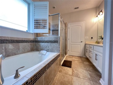 Welcome home to this beautiful one story home on a corner lot on Orange County National Golf Center and Lodge in Florida - for sale on GolfHomes.com, golf home, golf lot