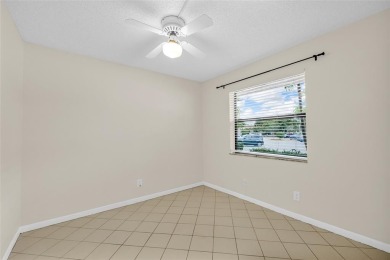 Explore this delightful first-floor unit, boasting two bedrooms on Sunrise Lakes Phase IV Golf Course in Florida - for sale on GolfHomes.com, golf home, golf lot