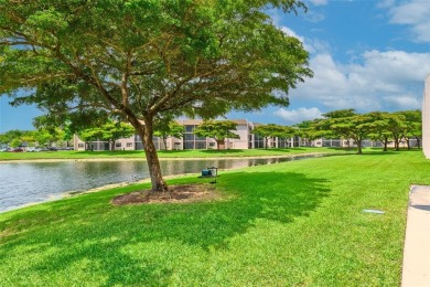 Explore this delightful first-floor unit, boasting two bedrooms on Sunrise Lakes Phase IV Golf Course in Florida - for sale on GolfHomes.com, golf home, golf lot