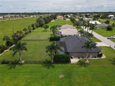 Welcome to Burnt Store Meadows and this amazing 2017 custom on Seminole Lakes Country Club in Florida - for sale on GolfHomes.com, golf home, golf lot