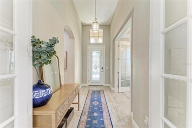 Experience tranquil Florida living in this stunning WCI-built on Sarasota National Golf Club in Florida - for sale on GolfHomes.com, golf home, golf lot