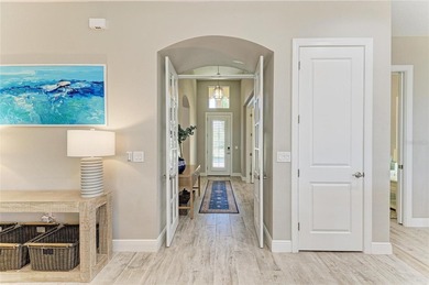 Experience tranquil Florida living in this stunning WCI-built on Sarasota National Golf Club in Florida - for sale on GolfHomes.com, golf home, golf lot