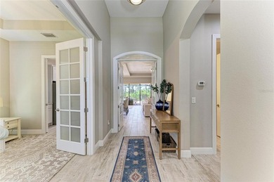 Experience tranquil Florida living in this stunning WCI-built on Sarasota National Golf Club in Florida - for sale on GolfHomes.com, golf home, golf lot