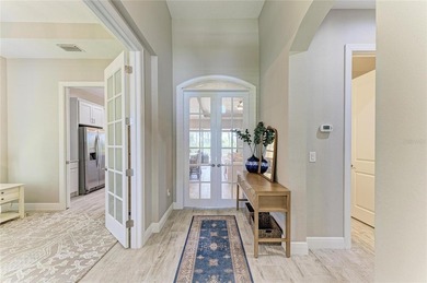 Experience tranquil Florida living in this stunning WCI-built on Sarasota National Golf Club in Florida - for sale on GolfHomes.com, golf home, golf lot