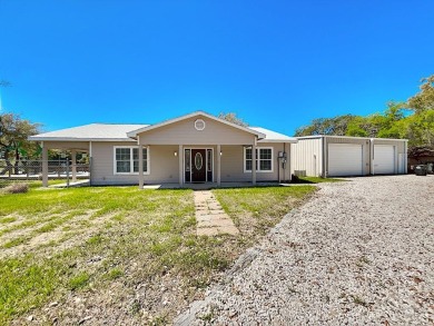 This is a Charming Coastal Retreat with detached barn nestled on Lamar Golf Course in Texas - for sale on GolfHomes.com, golf home, golf lot