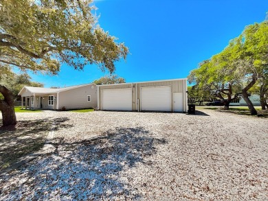 This is a Charming Coastal Retreat with detached barn nestled on Lamar Golf Course in Texas - for sale on GolfHomes.com, golf home, golf lot