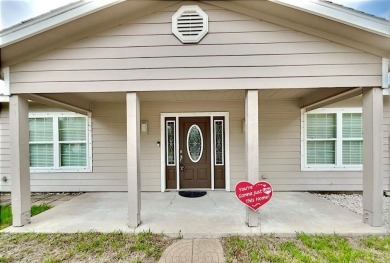 This is a Charming Coastal Retreat with detached barn nestled on Lamar Golf Course in Texas - for sale on GolfHomes.com, golf home, golf lot