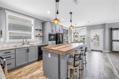 WATERFRONT LIVING | Fully Furnished | 2021 Palm Harbor Home
 on Mangrove Bay Golf Course in Florida - for sale on GolfHomes.com, golf home, golf lot