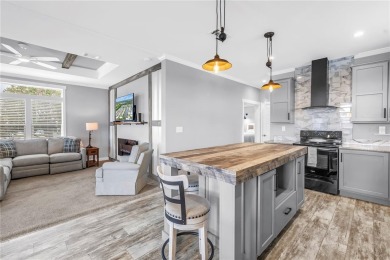 WATERFRONT LIVING | Fully Furnished | 2021 Palm Harbor Home
 on Mangrove Bay Golf Course in Florida - for sale on GolfHomes.com, golf home, golf lot